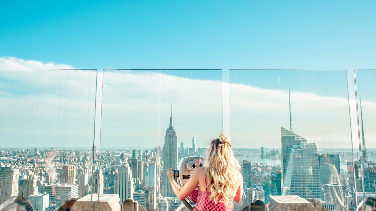woman using gray stationary bike