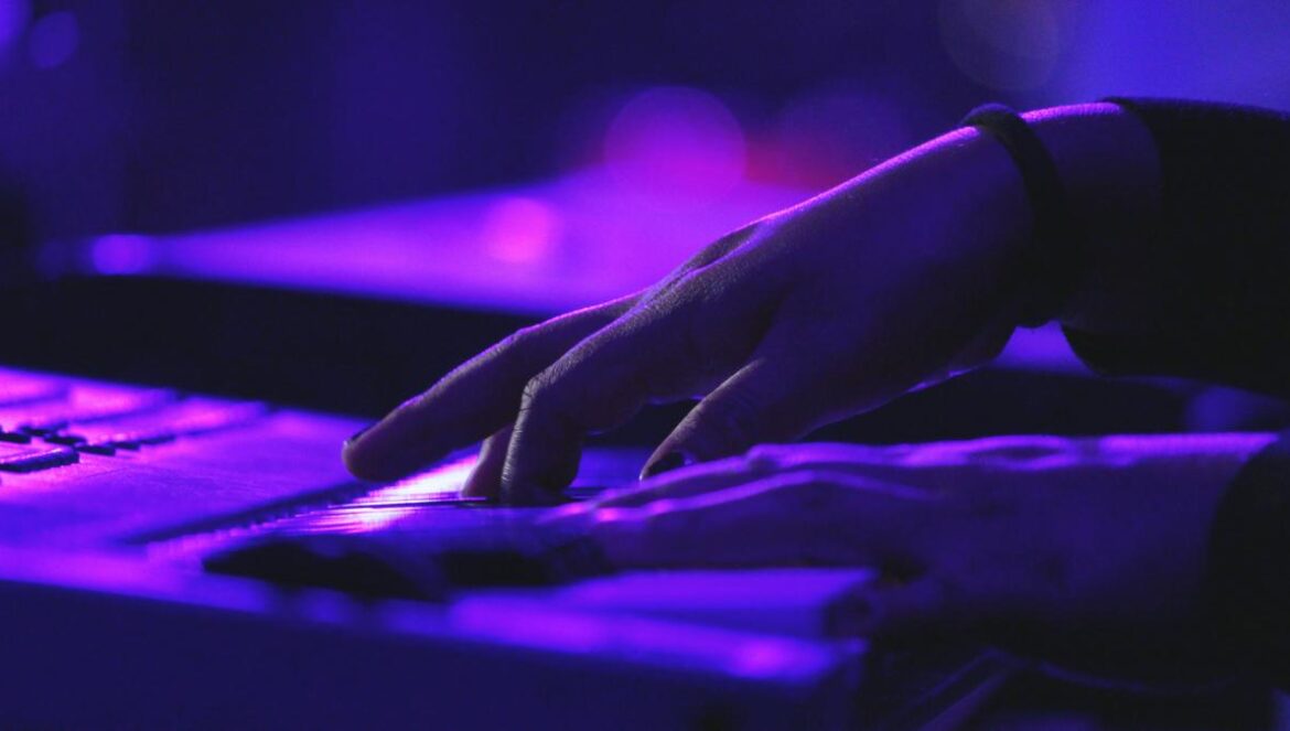 person's hand on laptop