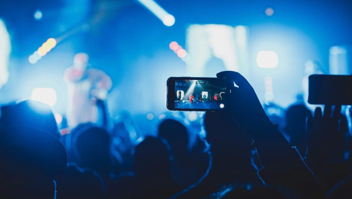 person taking picture on stage
