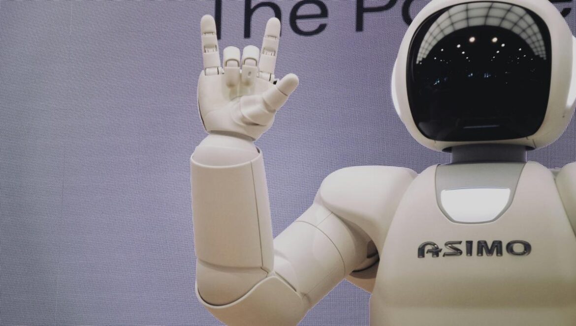 Asimo robot doing handsign