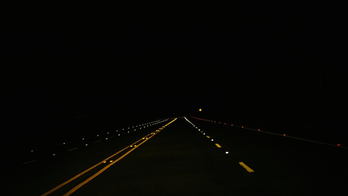 black concrete road during nighttime