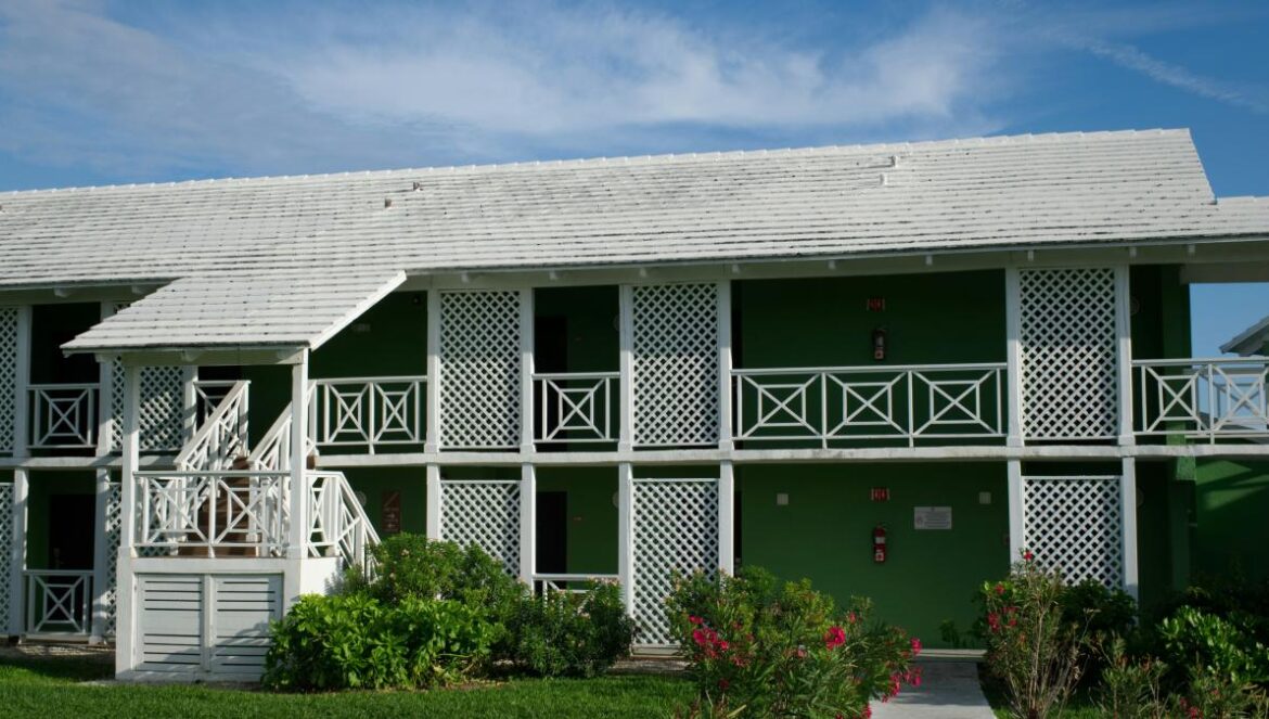 white and green concrete house during daytime