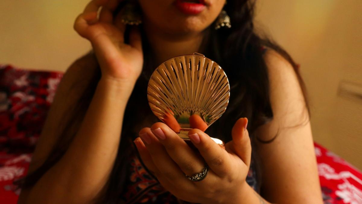 woman wears red lipstick