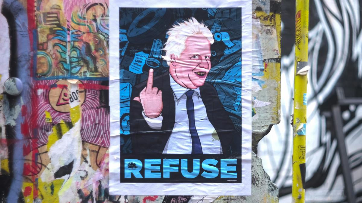 man in black and white shirt painting