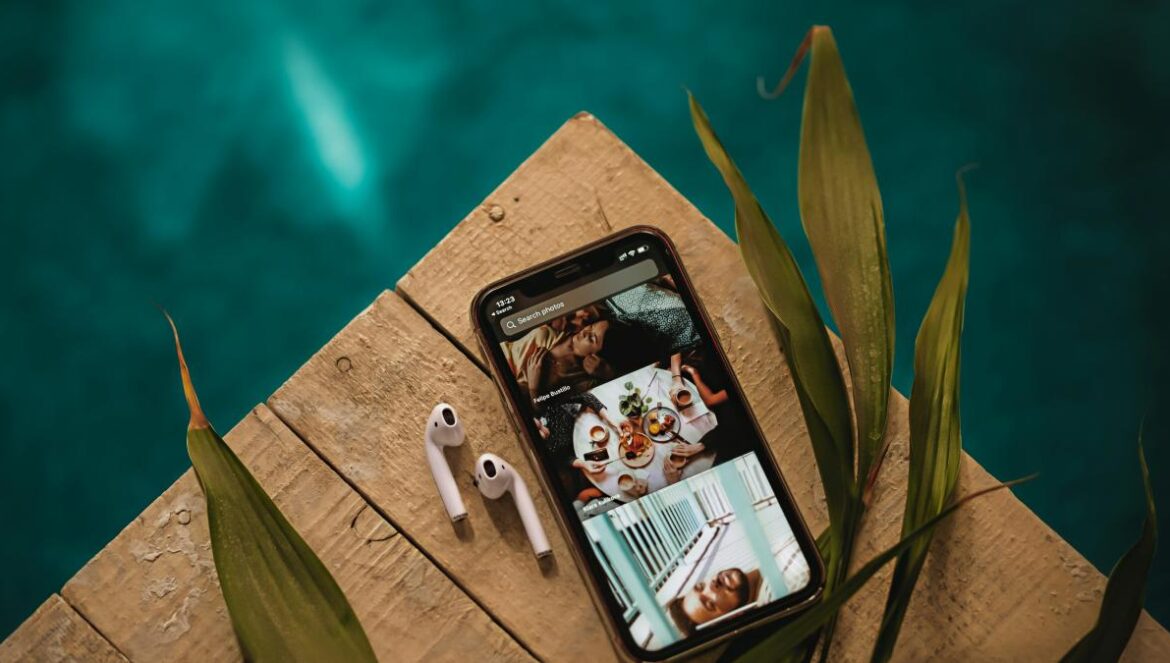 black iphone 4 on brown wooden table