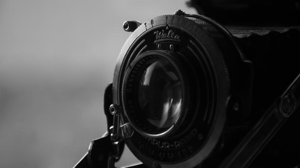 black and silver dslr camera