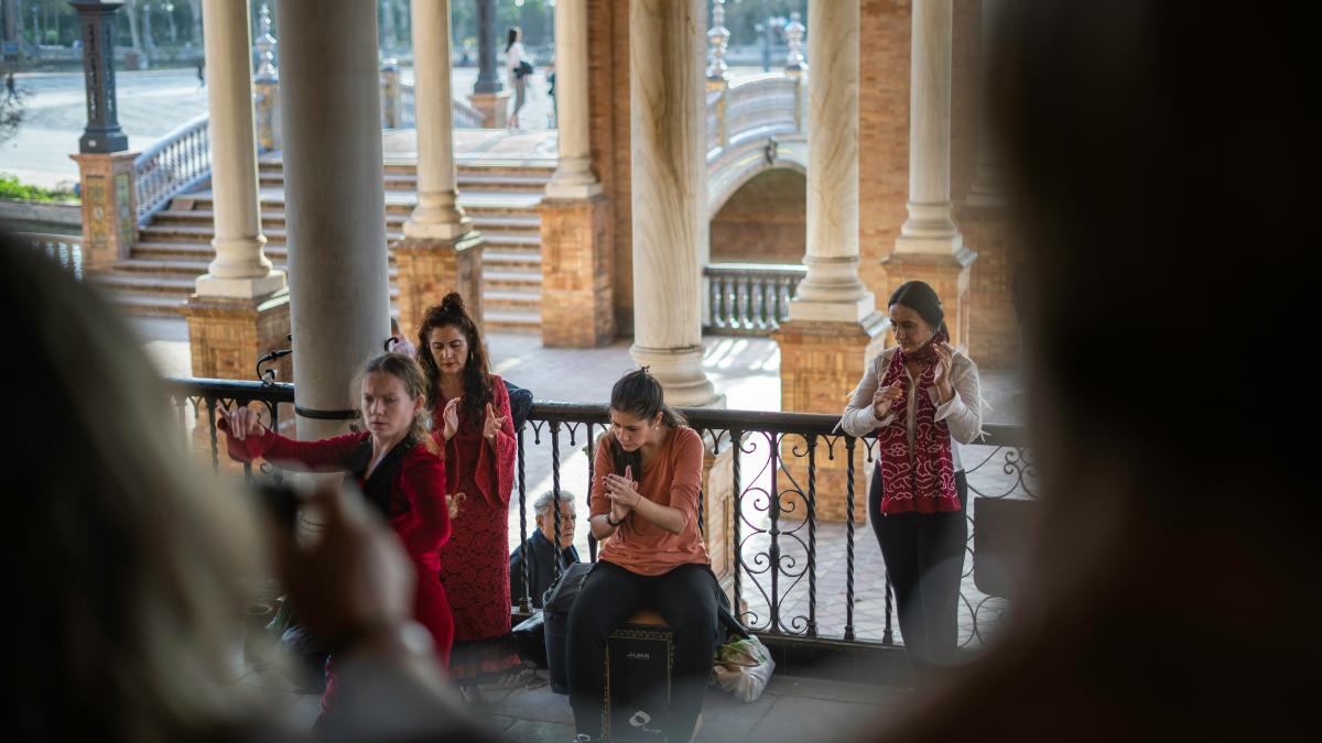 people sitting on chair near building during daytime