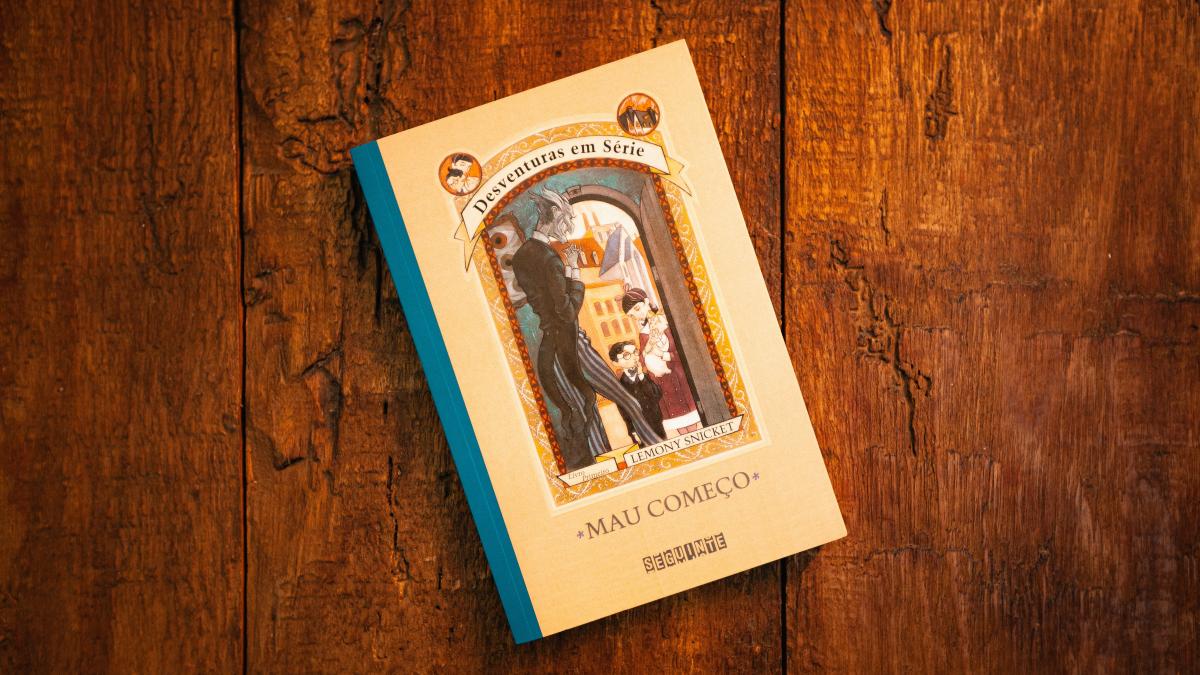 white and blue book on brown wooden table