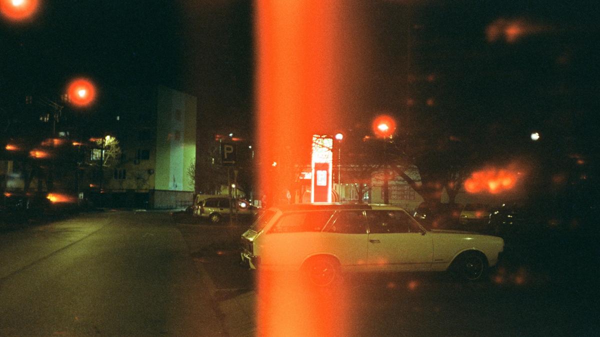 white sedan on road during night time