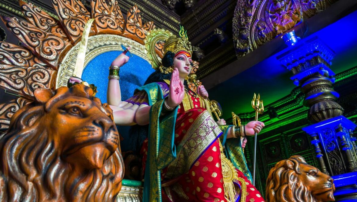 gold and red hindu deity statue