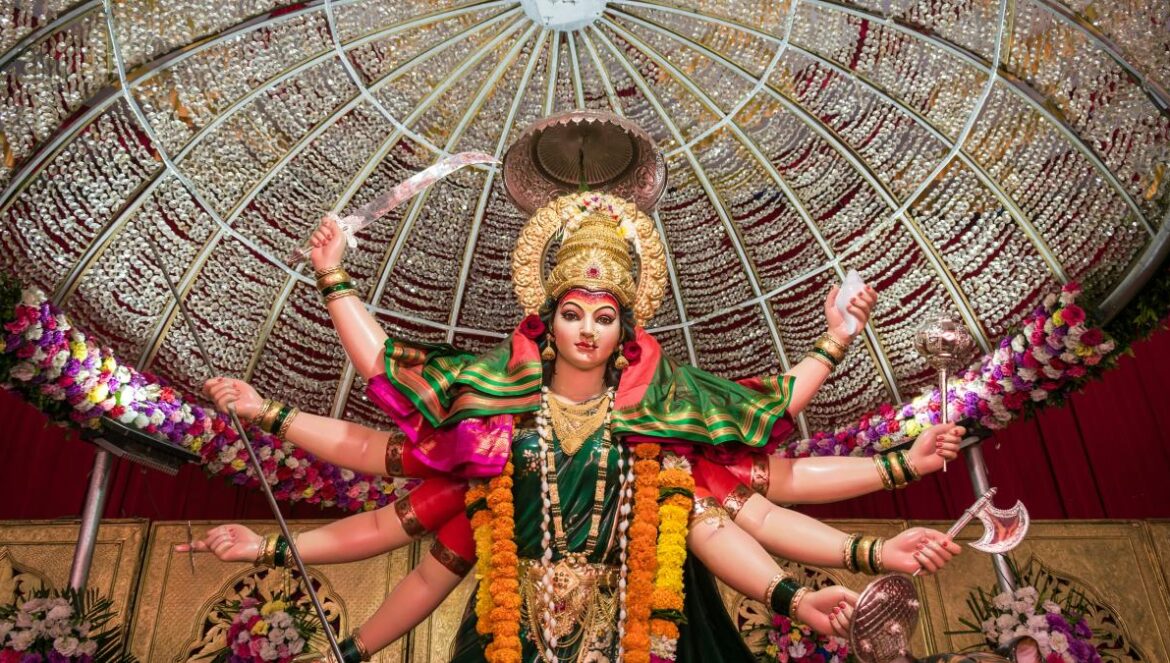 woman in green and gold traditional dress