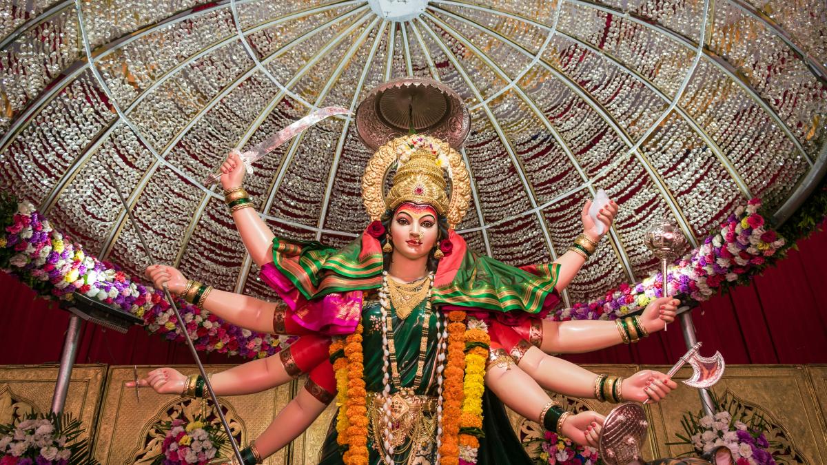 woman in green and gold traditional dress