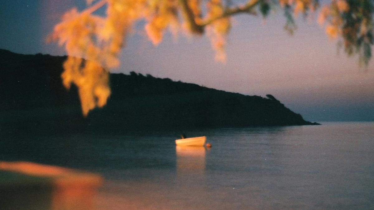 white boat on body of water during daytime