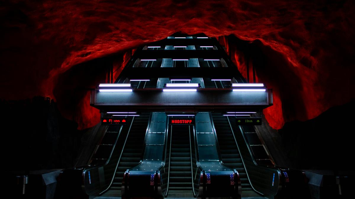 black and red car in a parking lot