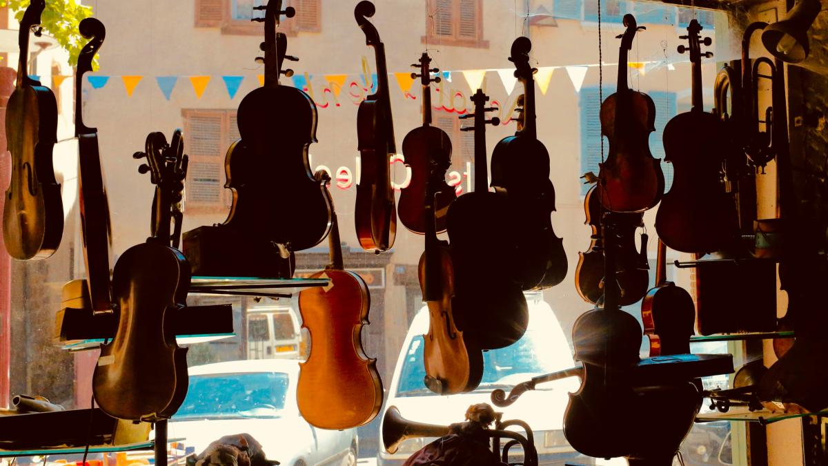 brown and black acoustic guitars