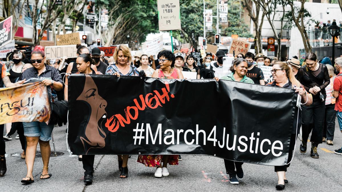people in black dress holding black textile