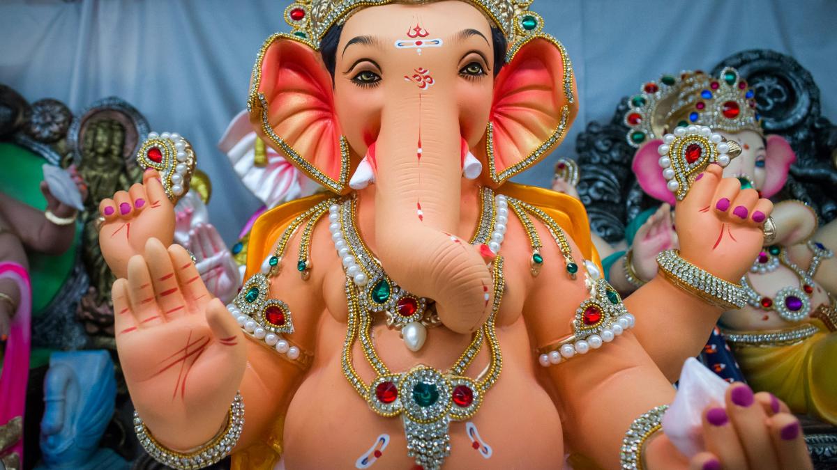 woman in gold and red crown