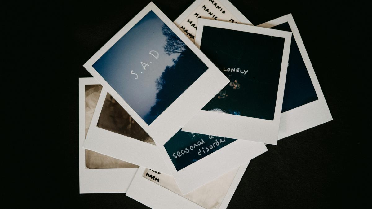 white and blue cards on black surface