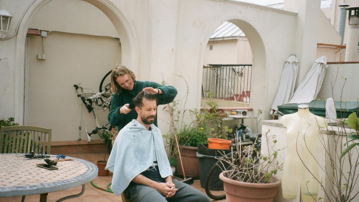 woman in blue denim jacket sitting on chair