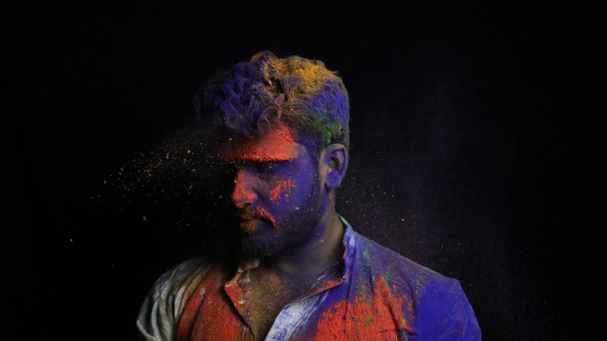 man in blue and orange shirt