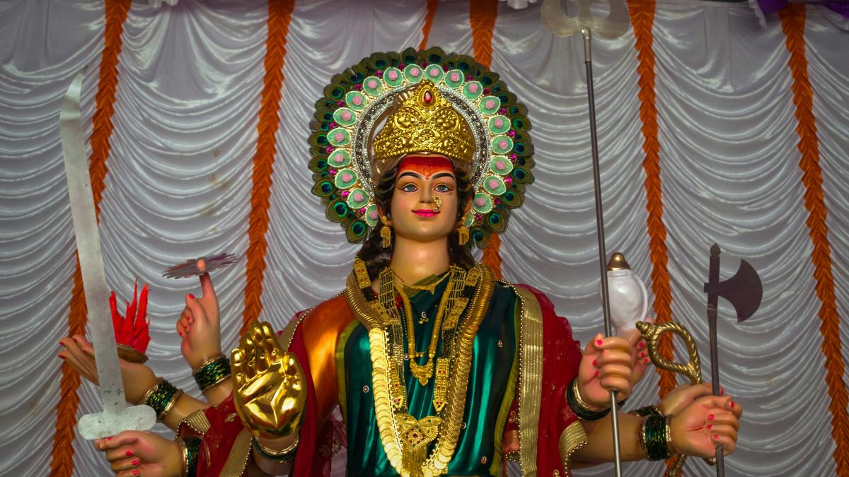 woman in gold and red traditional dress