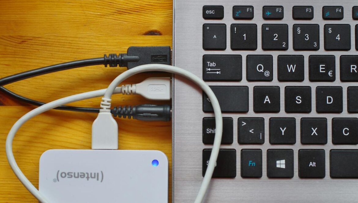 white usb cable on gray laptop computer