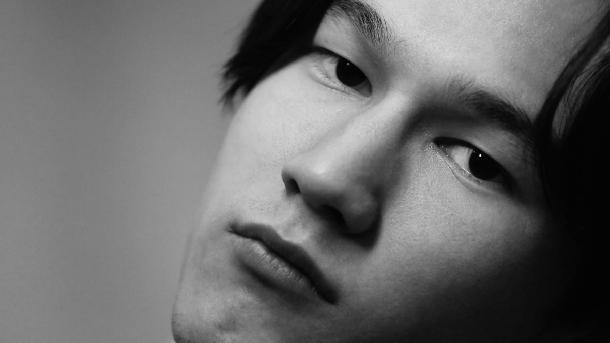 grayscale photo of mans face