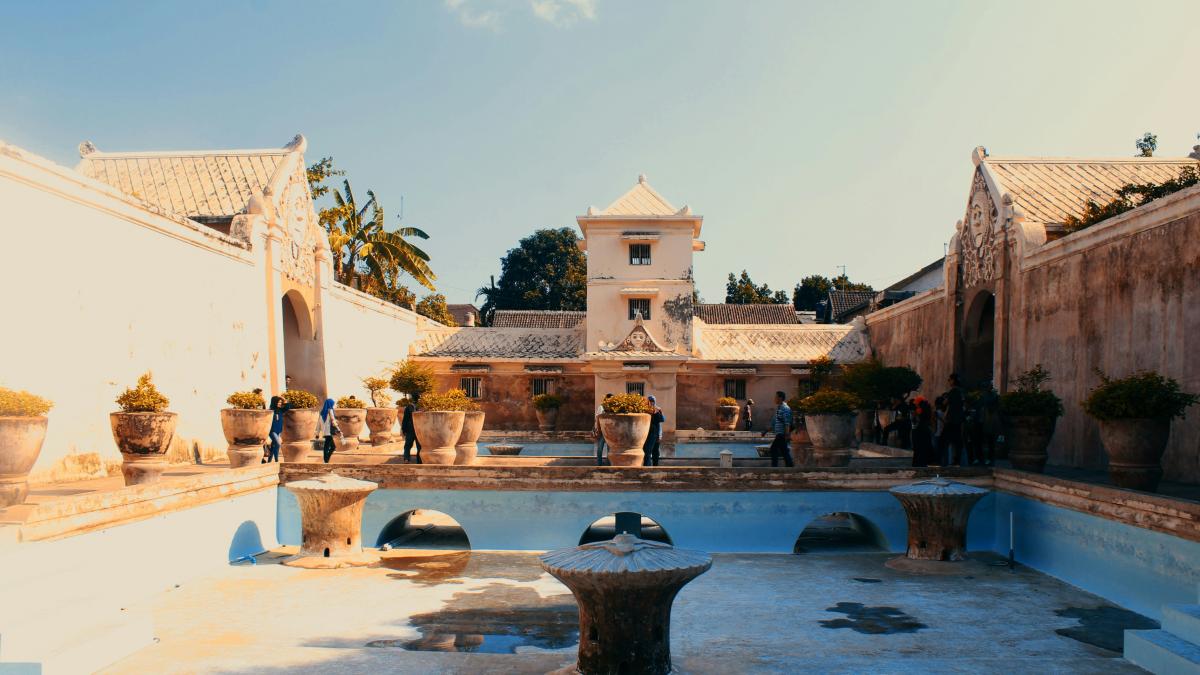white concrete building near body of water during daytime
