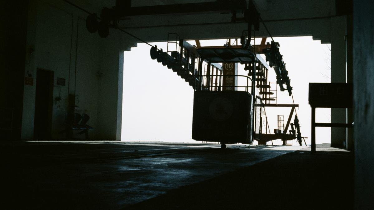 a room with a ladder and a clock on the wall
