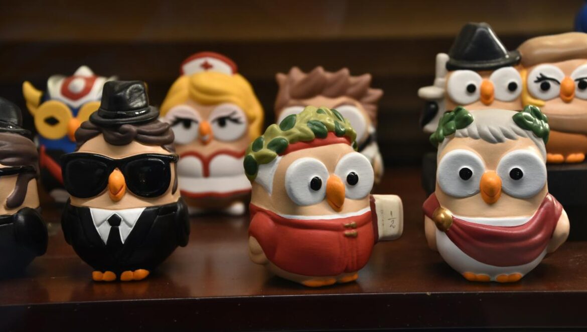 a group of small figurines of people wearing hats and glasses
