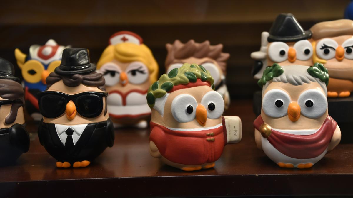 a group of small figurines of people wearing hats and glasses