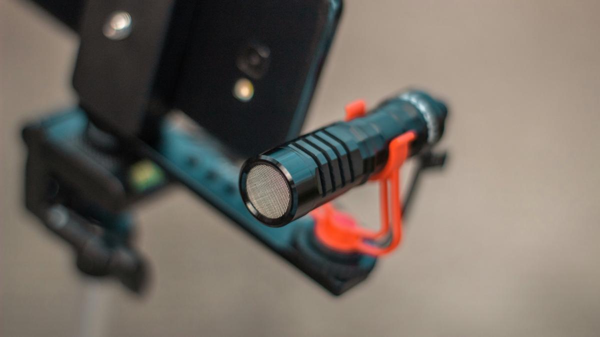 a close up of a cell phone on a tripod