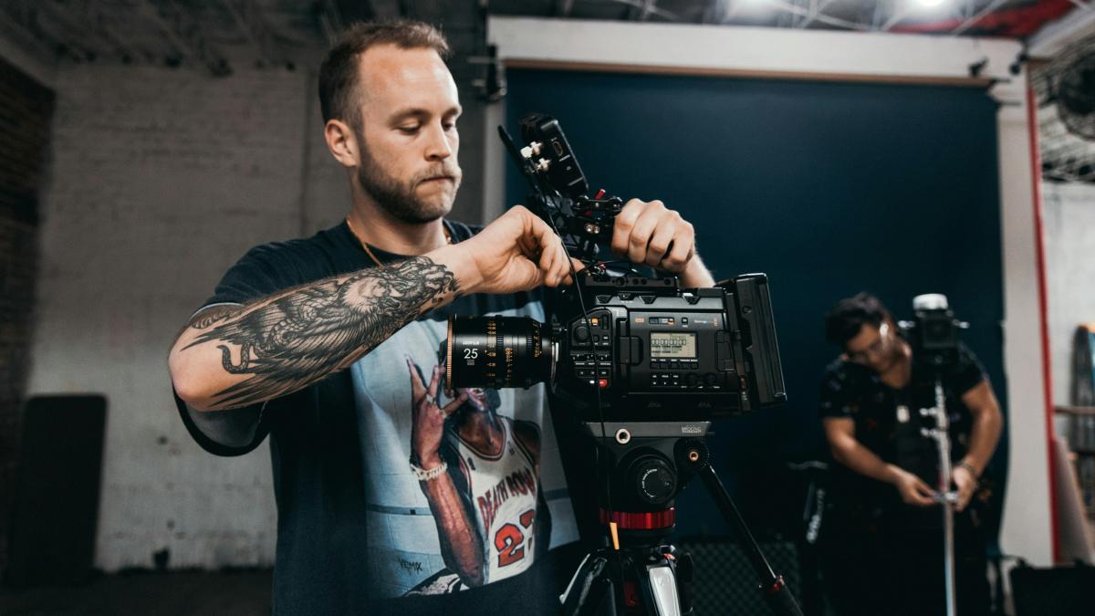a man holding a camera in front of a camera