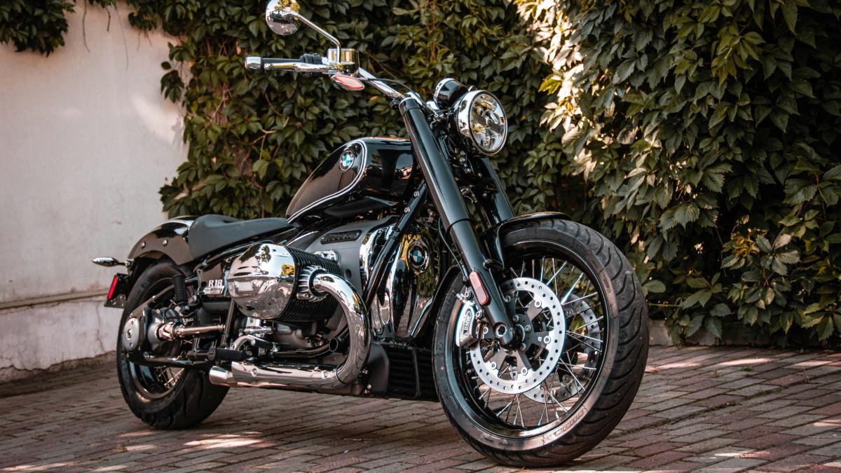 a motorcycle parked on a brick surface