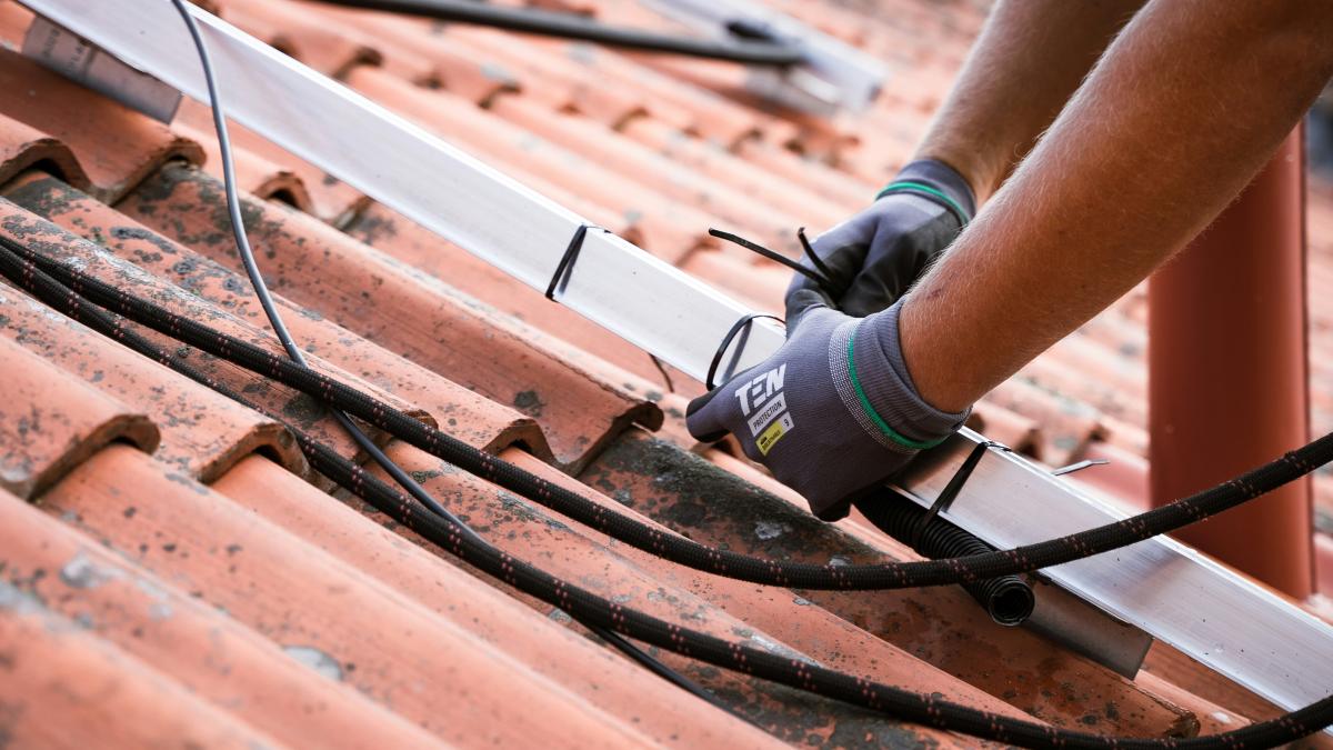 a person's hand on a bicycle tire