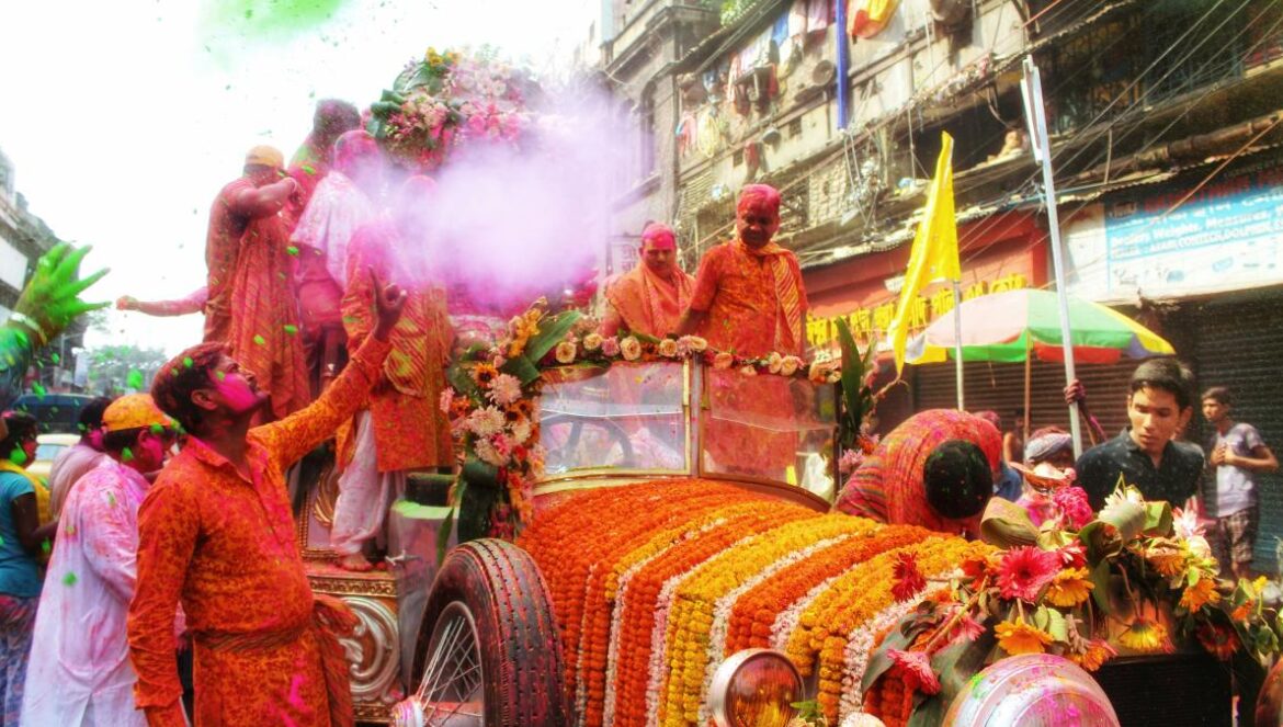 a group of people in clothing on a parade float