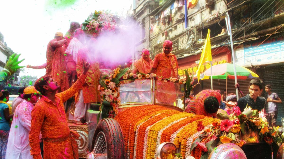 a group of people in clothing on a parade float