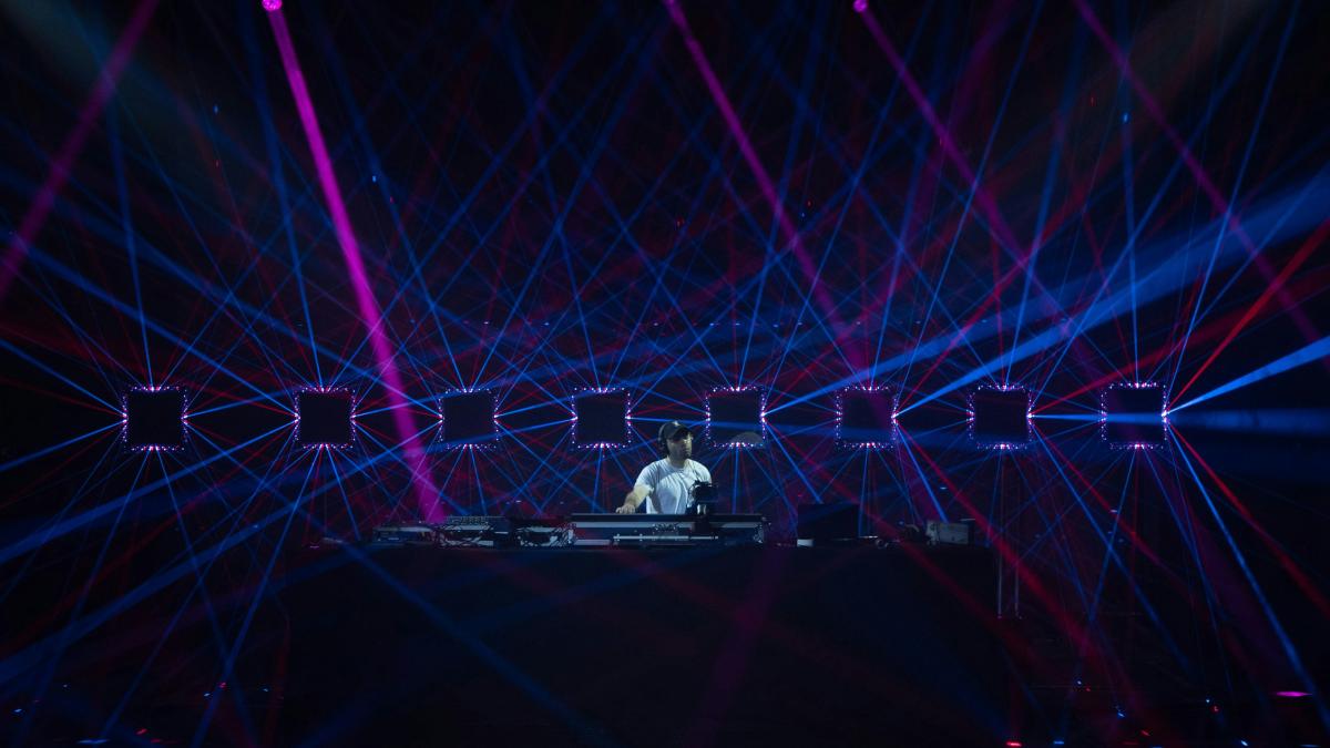 a person on a stage with lights