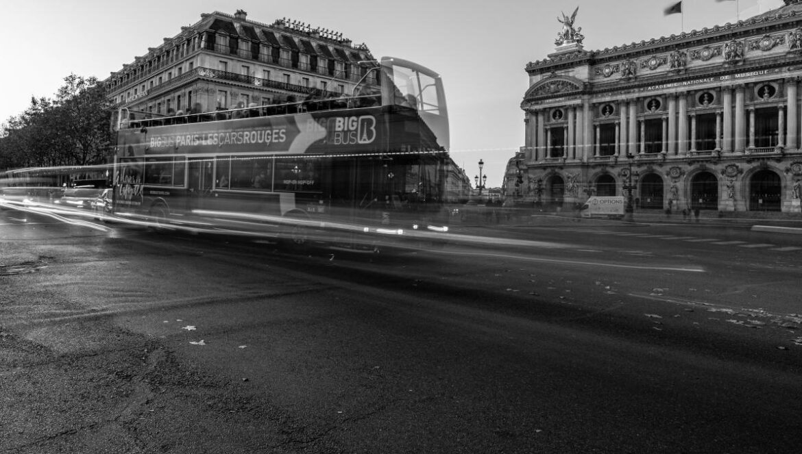 a bus driving down a street