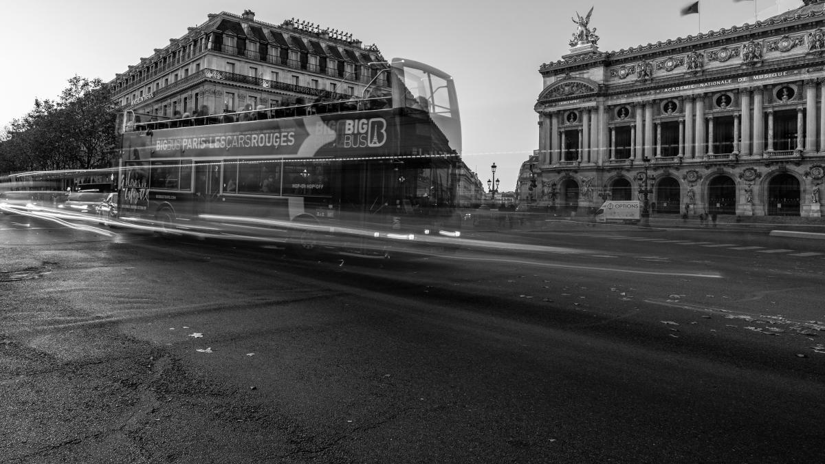 a bus driving down a street