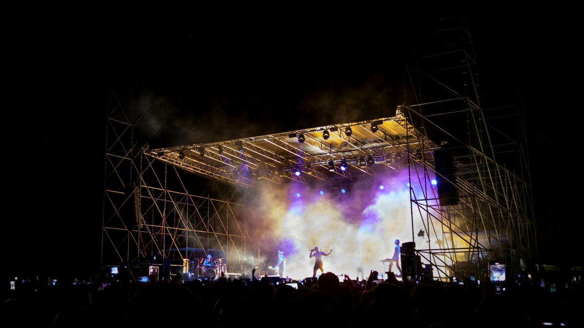 a stage with a crowd watching