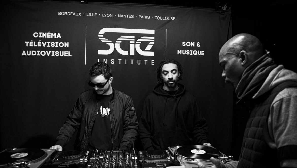 three men in masks are at a dj booth