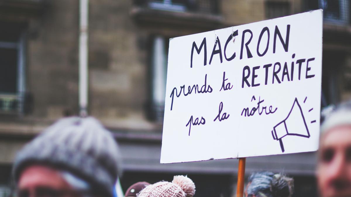 a group of people holding a protest sign