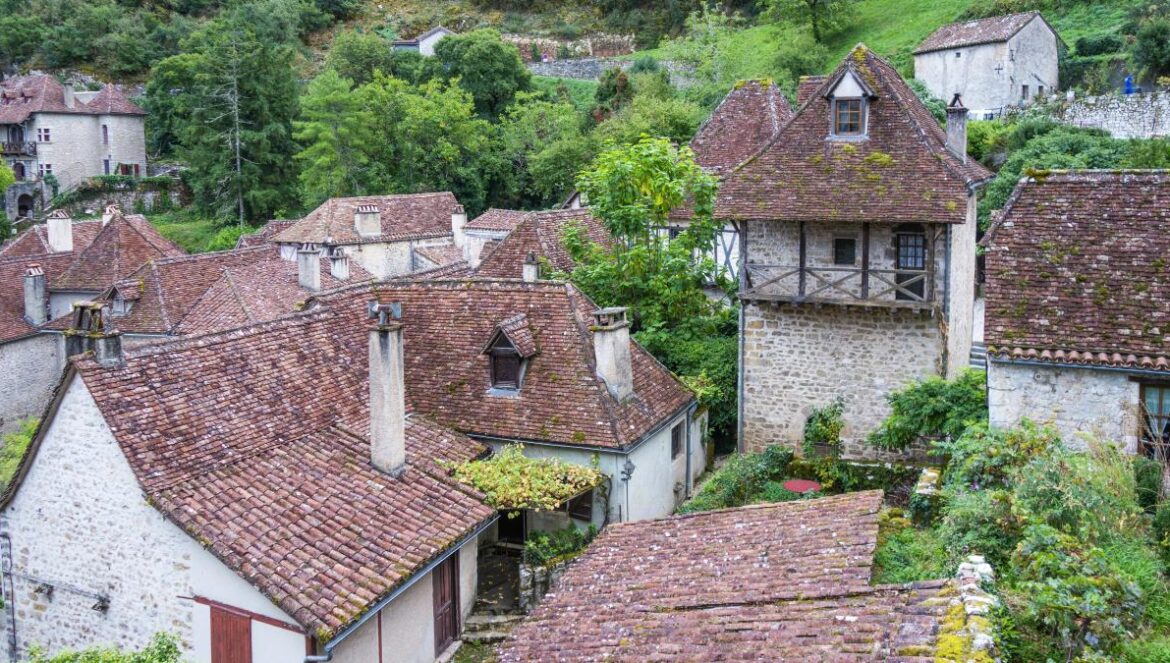 an aerial view of a village in the mountains