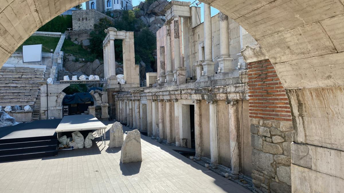 a view of a building from under a bridge