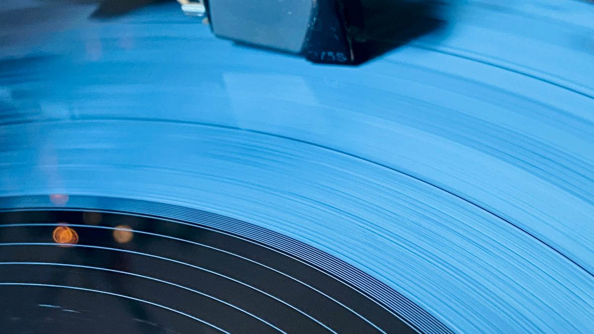 a record player playing a record on a turntable