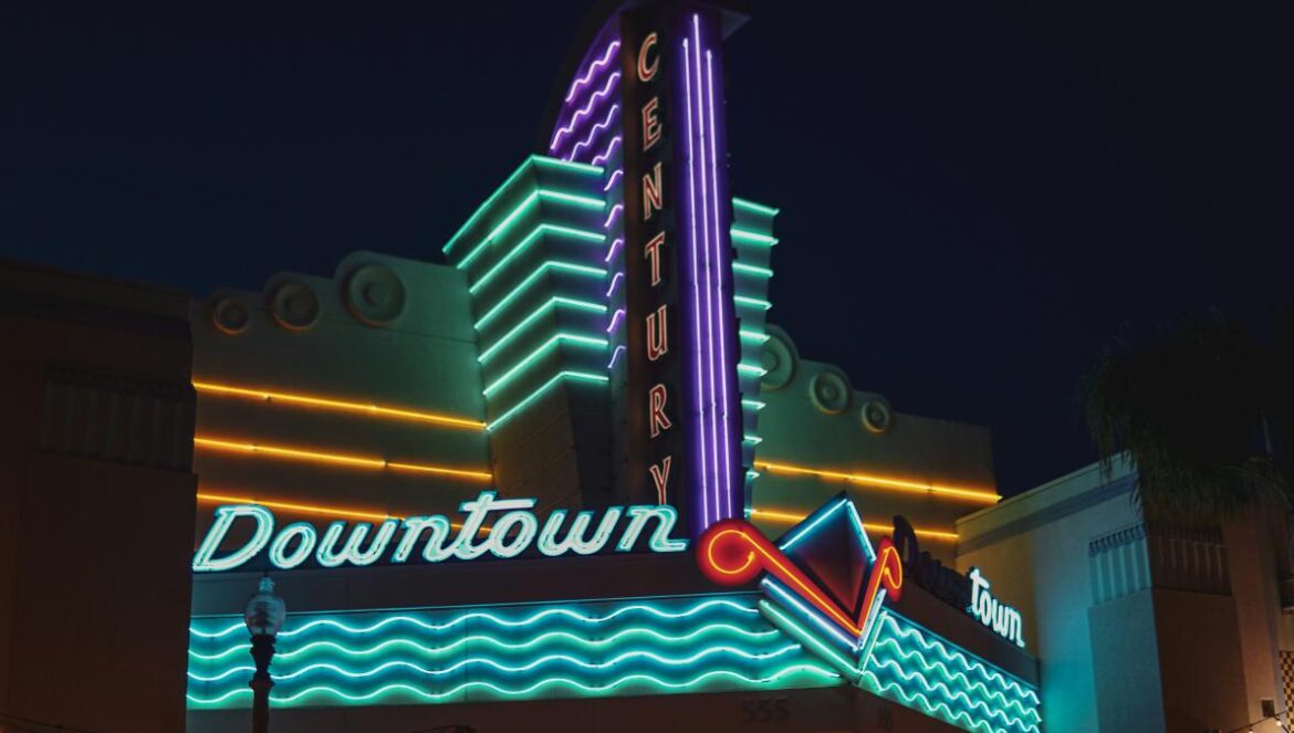 a neon sign on the side of a building