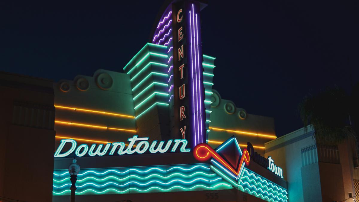 a neon sign on the side of a building