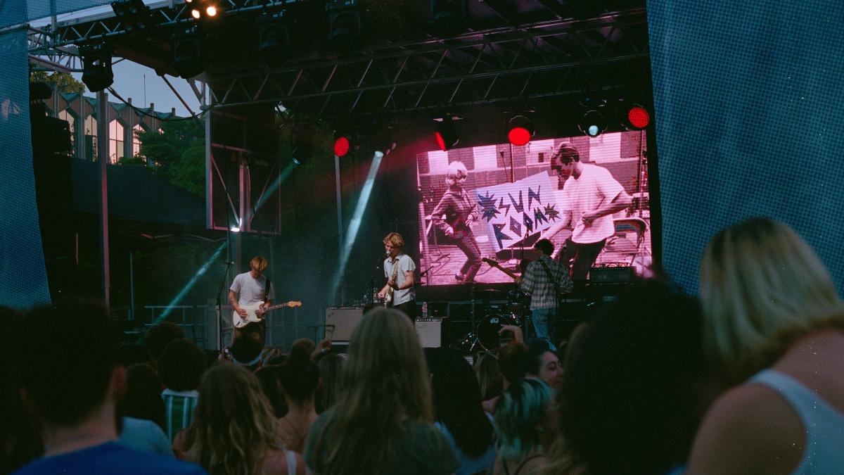 a group of people standing on top of a stage