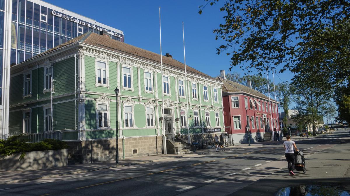 a person riding a bike on a city street